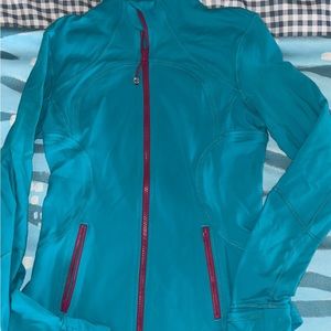 Lululemon athletics define zip up jacket. Teal w/ pink accents. Size 8.